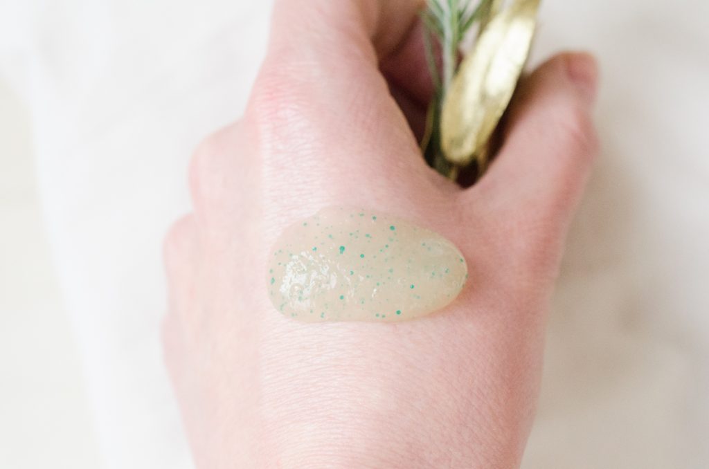 Lavera Purifying Scrub on the back of my hand showing jojoba beads