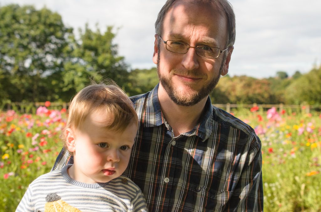 Martin and Jonah in front of the wild flowers