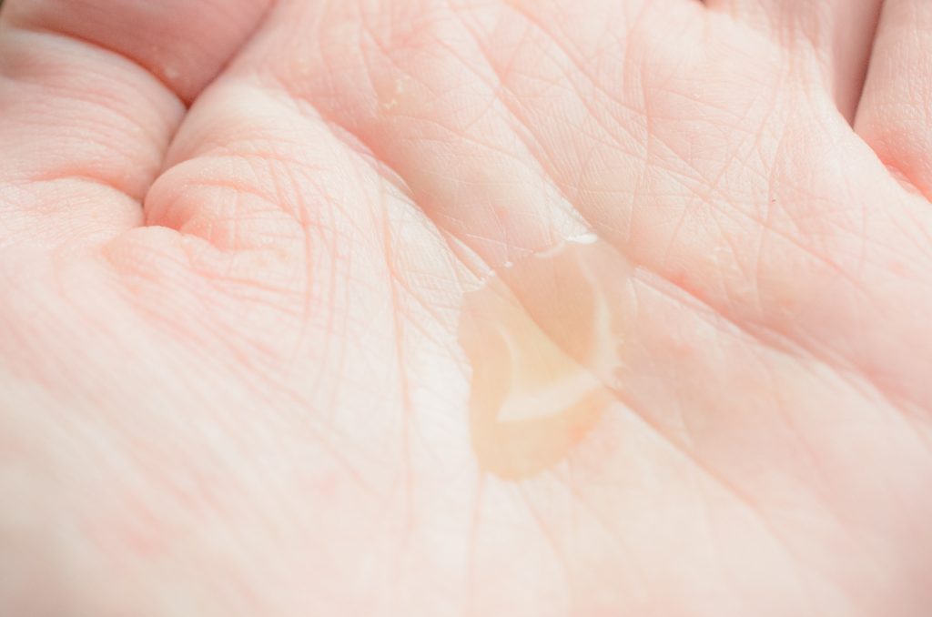 Weleda Nursing Oil in the palm of my hand