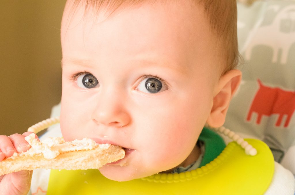 Jonah aged 9 months eating toast