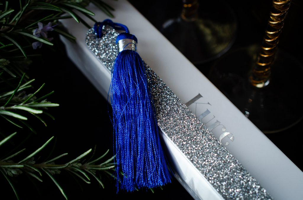 Kure Bazaar Pompom Nail File in silver and blue
