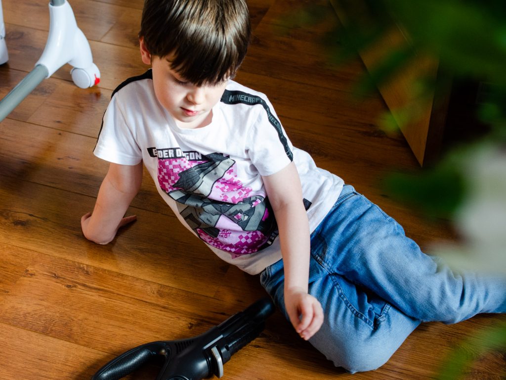 Jonah relaxing with the vacuum cleaner