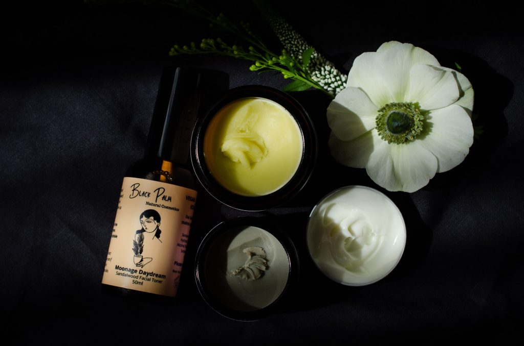 Some Black Palm skincare including Palm Balm, Facial Toner, Facial Moisturiser, and Deodorant Clay.