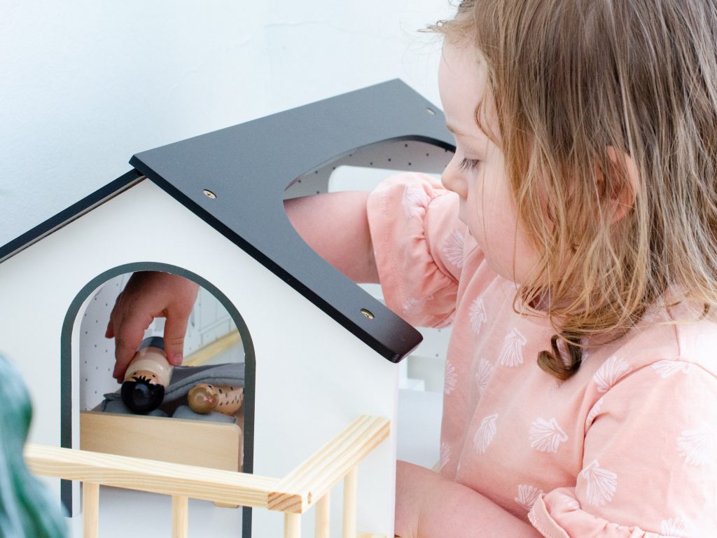 Cara playing with the Petite Amélie Dolls House