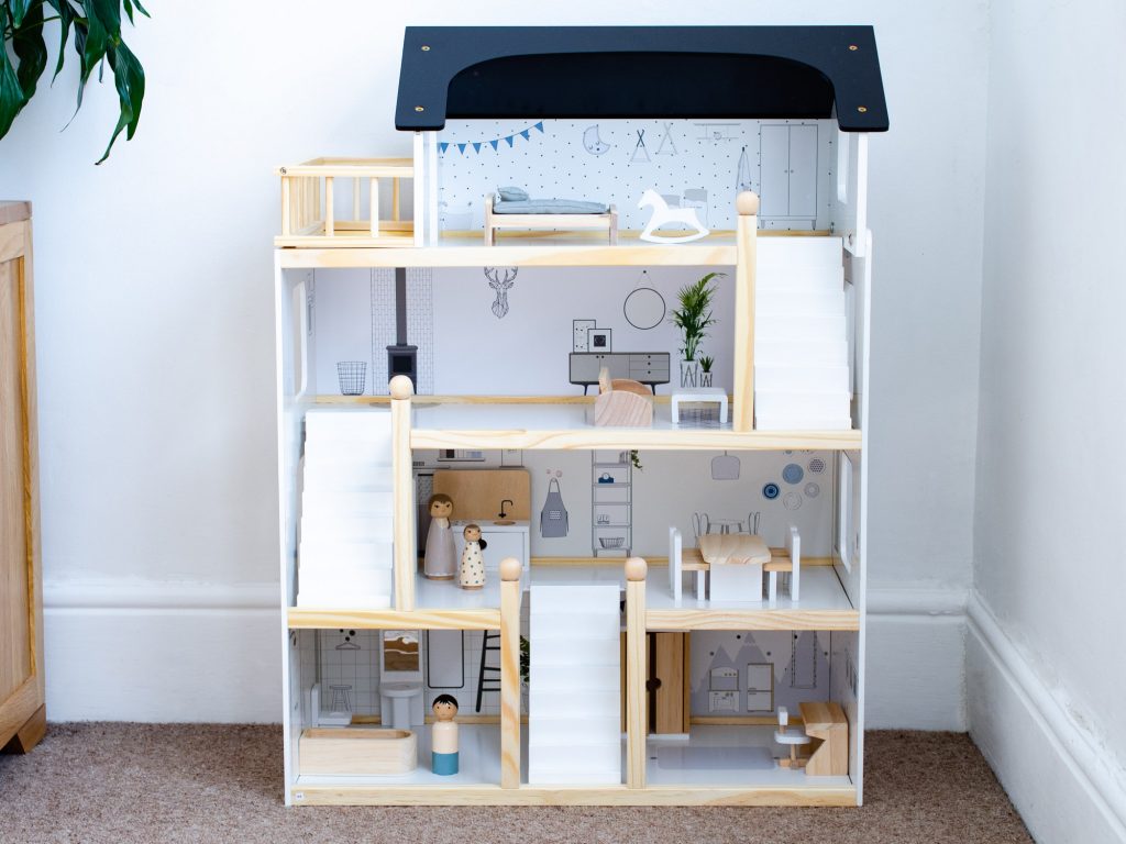 The finished dolls house complete with furniture and dolls