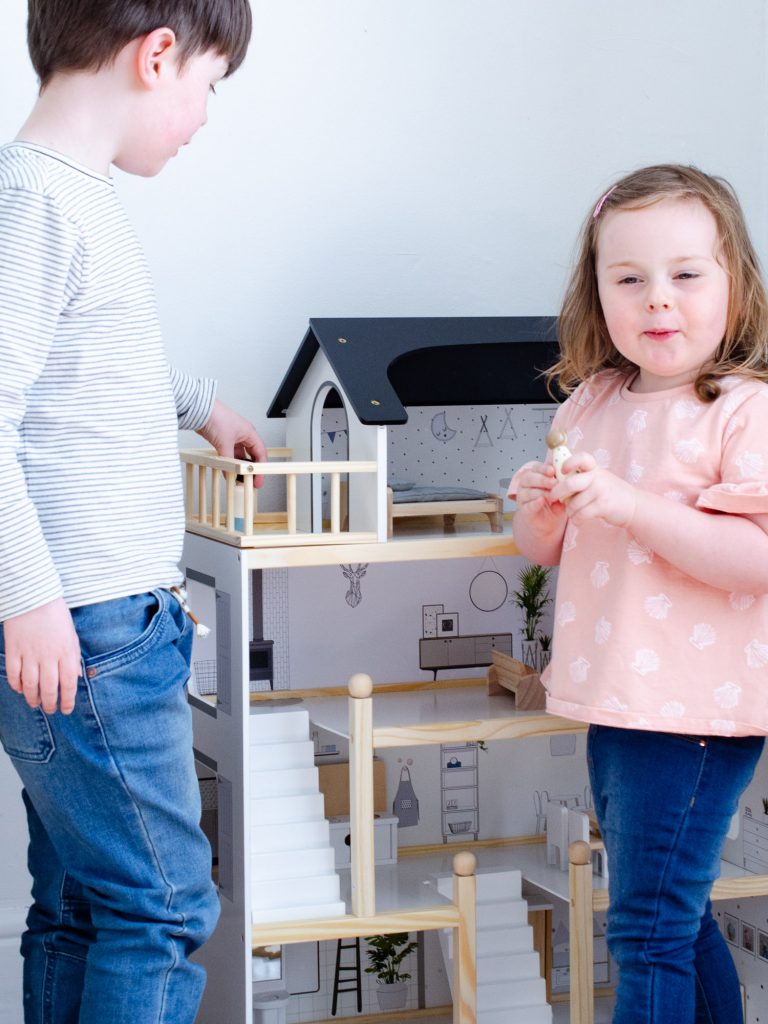 Playing with the dolls house together