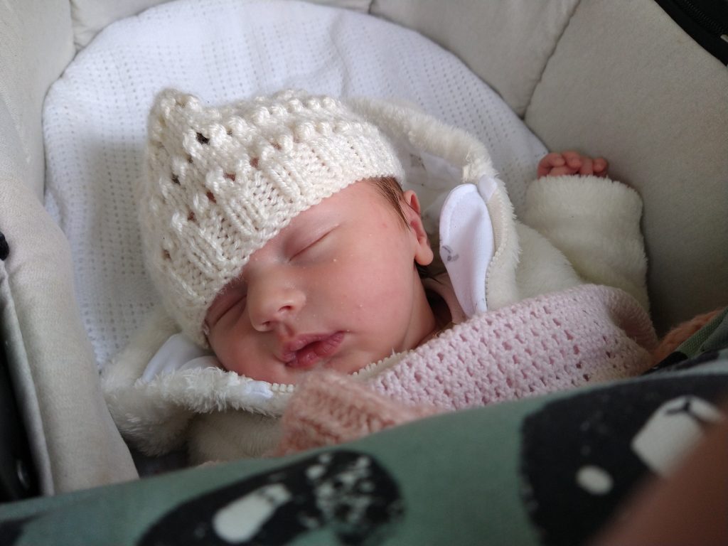 Lydia in her pram