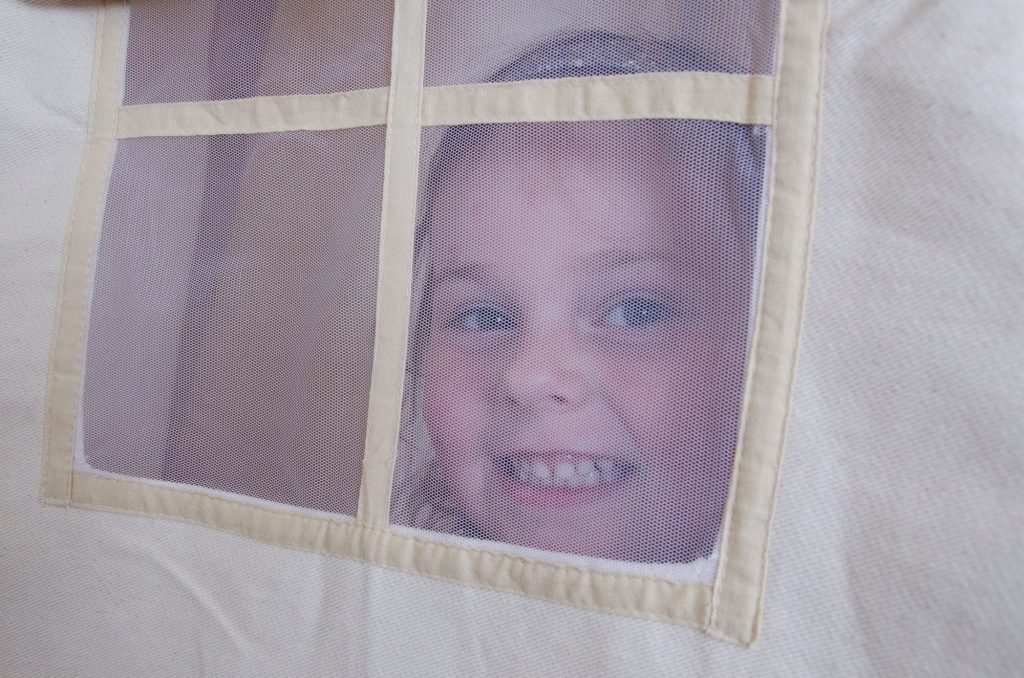 Cara at the teepee window