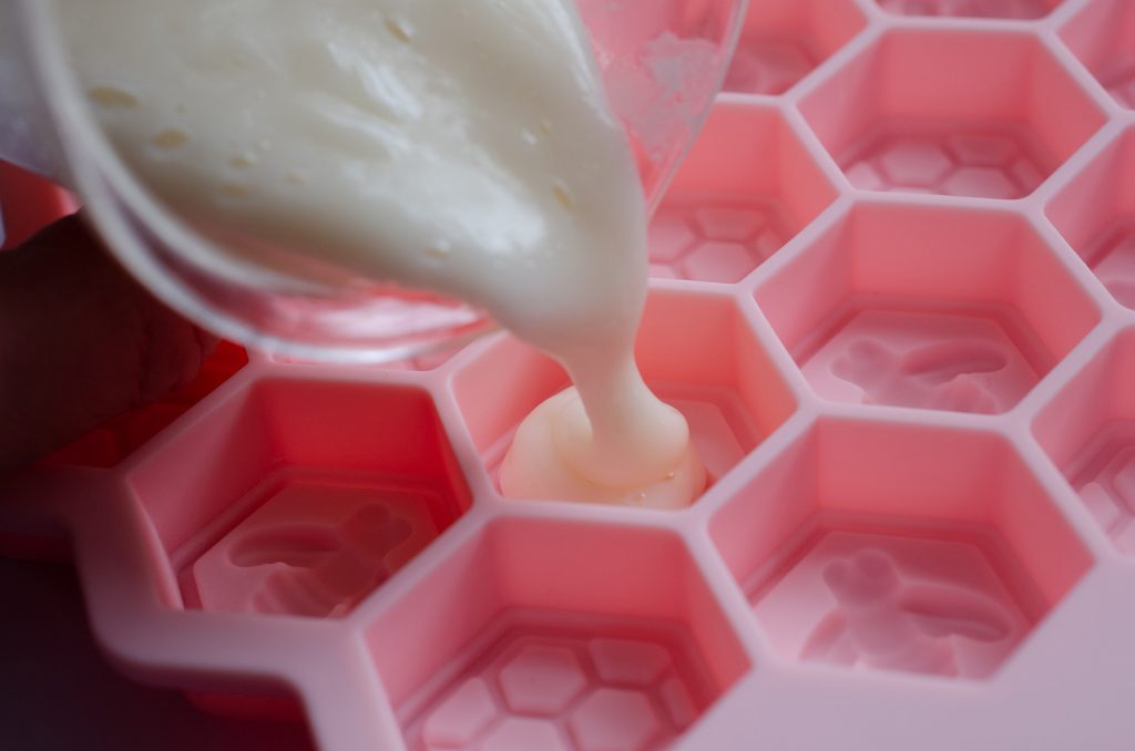 Pouring the breast milk lotion into moulds