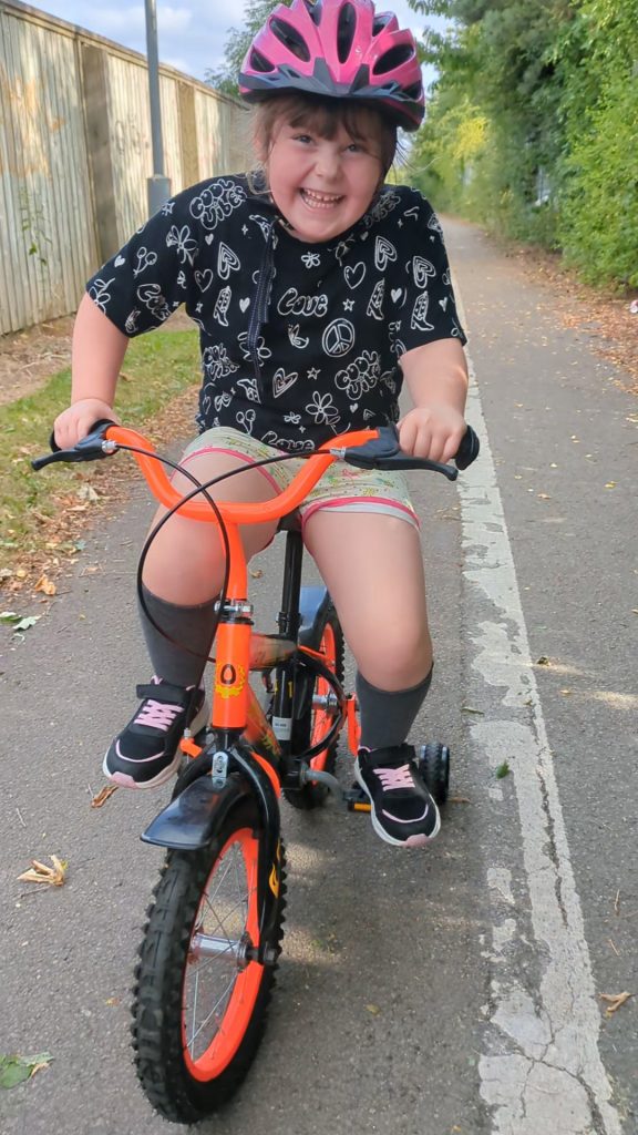 Cara riding her bike
