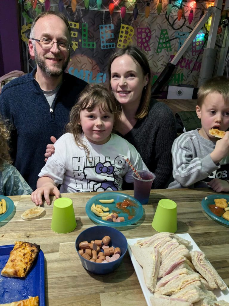 Cara, mummy, daddy, and Archie on Cara's birthday